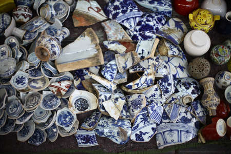 Color picture of many broken vases in a market.の写真素材