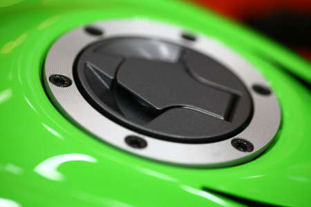 Close-up shot of a motorcycle tank cap.