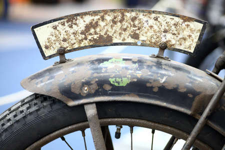 Color detail of a rusty motorcycle front license plate.の写真素材