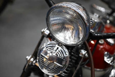 Color image of a motorcycle headlight and horn.