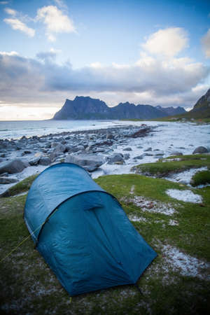 Color image of a tent on a beach, during evening.の写真素材