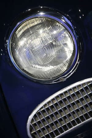 Color image with the headlight of a vintage car.の写真素材