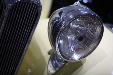 Color detail on the headlight of a vintage car.の写真素材
