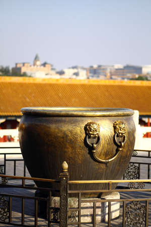 Large bronze bowl to extinguish fire with image Chinese dragon statue in the Forbidden City, Beijing, Chinaの写真素材