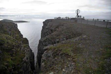 Nordakpp, Norway - June 27, 2015: People are pictured around the Norkapp monument in Norway, Europe's northernmost point.のeditorial素材