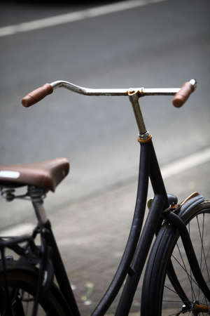 Color image of a parked bicycle on a street.