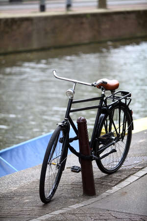 Color image of a parked bicycle on a bridge.の写真素材