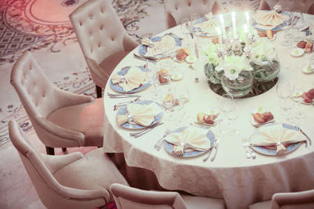 Color image of an empty dinner table.