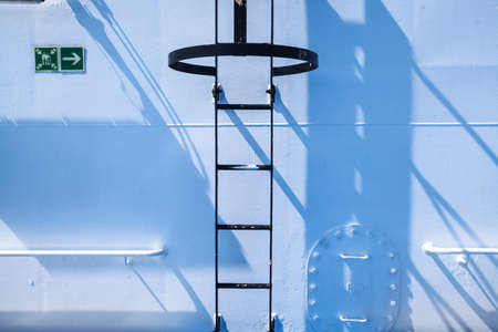 Color image of a metal staircase on a wall.の写真素材