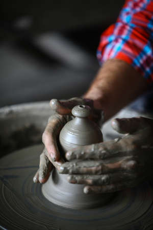 Color image with the hands of a potter working.の写真素材