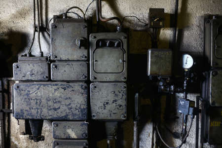Color image of a rusty electrical system on a wall.の写真素材