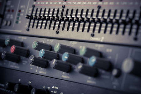 Color image of many buttons in a sound recording studio.