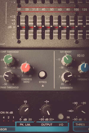 Color image of many buttons in a sound recording studio.