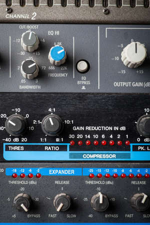 Color image of many buttons in a sound recording studio.