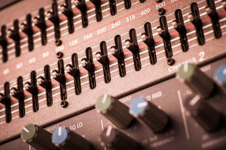 Color image of many buttons in a sound recording studio.