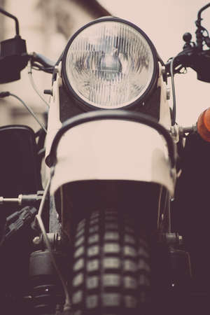 Color image of a classic motorcycle headlight.