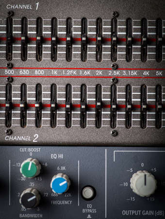 Color image of many buttons on a sound mixer in a recording studio.の写真素材