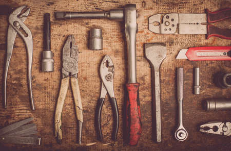 Color image of many tools on a wooden plank.の写真素材