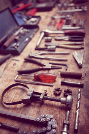 Color image of many tools on a wooden plank.の写真素材