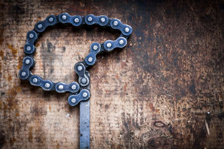Color image of an oil filter removal tool on a wooden plank.の写真素材