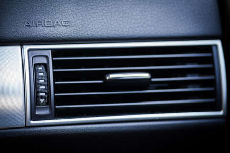 The word Airbag is written on a car's dashboard.