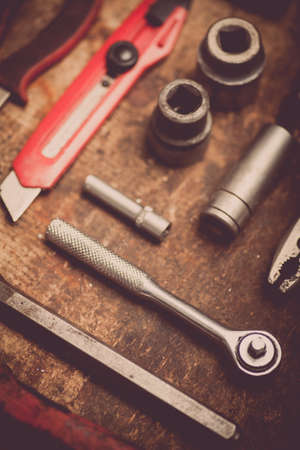 Color image of many tools on a wooden plank.の写真素材