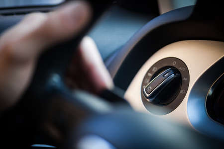 Detail of the headlight button in a car.の写真素材