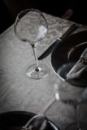 Empty dinner table in a luxury restaurantの写真素材