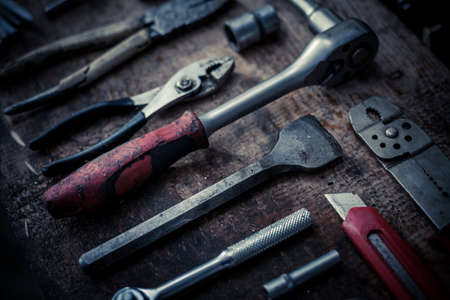 Color image of many tools on a wooden plank.の写真素材