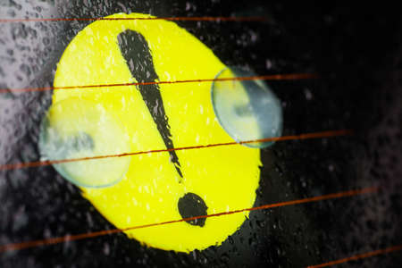Color image of a beginner driver sign stuck on a car's windshield.