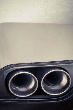 Close up shot of a car's double exhaust pipe.の写真素材