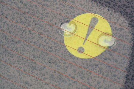 Color image of a beginner driver sign stuck on a car's windshield.の写真素材
