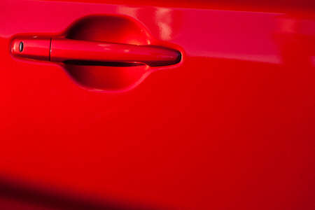 Color image of a red car door handle.の写真素材