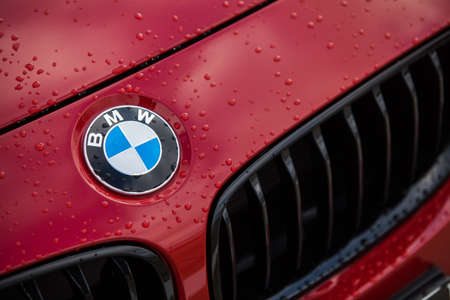 Bucharest, Romania - May 22, 2016: Detail of the vent of a BMW logo on a car, on a rainy day. BMW is a vehicle, motorcycle, and engine manufacturing company from Munich, Bavaria, Germanyのeditorial素材