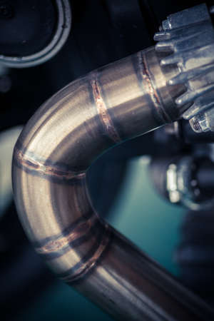 Detail of a motorcycle exhaust pipes and cylinders.の写真素材