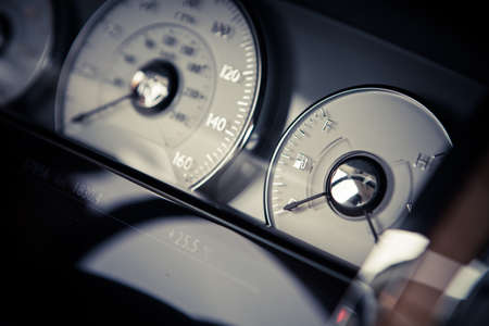 Close up shot of a car's dashboard with the fuel gauge.の写真素材