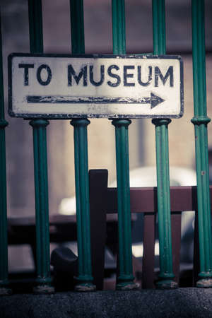 Color image of a signpost showing directions to the museum.の写真素材