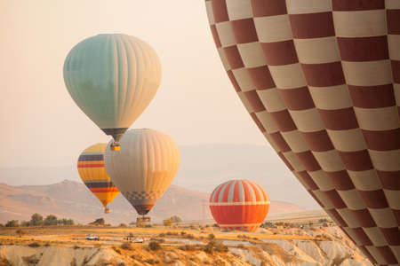 Color image of hot air balloons flying in Cappadocia, Turkey, at sunrise.の写真素材