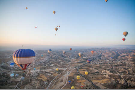 Color image of hot air balloons flying in Cappadocia, Turkey, at sunrise.の写真素材
