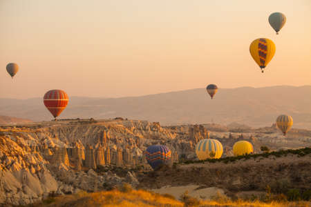 Color image of hot air balloons flying in Cappadocia, Turkey, at sunrise.の写真素材