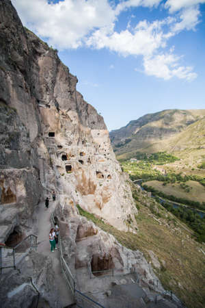 Vardzia, Georgia - September 21, 2016: Color image of some cave dwellings in Vardzia, Georgia and some tourists.のeditorial素材