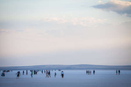 Lake Tuz, Turkey - September 25, 2016: Color image of people walking on Tuz salt lake in Turkey. Lake Tuz  is one of the largest hypersaline lakes in the world.のeditorial素材