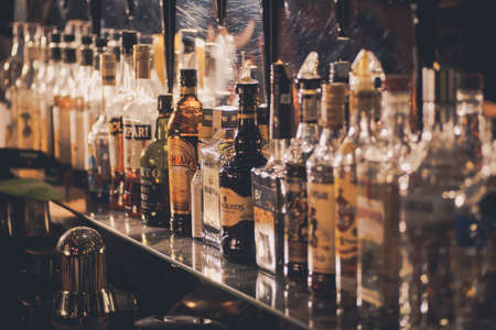 Bucharest, Romania - October 29, 2016: Image of various alcohol bottles in a pub in Bucharest, Romania.のeditorial素材