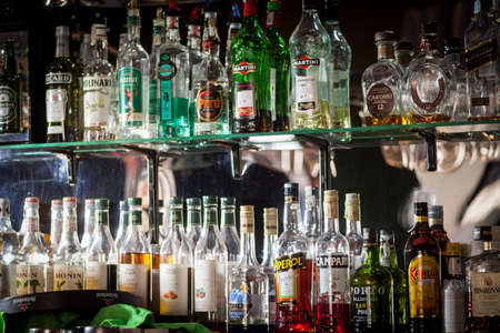 Bucharest, Romania - October 29, 2016: Image of various alcohol bottles in a pub in Bucharest, Romania.のeditorial素材