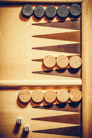 Backgammon board with double six dice, shot from above.