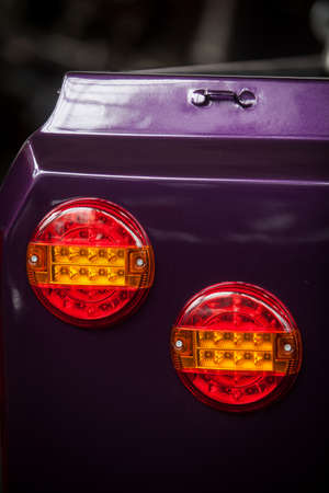 Close up shot of a vintage car rear lights.
