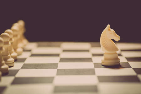 Shot of a chess board white horse moving.