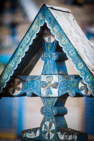 Image of a traditional painted cross in Sapanta, Romania, in a graveyard called "The Merry Cemetery".の写真素材