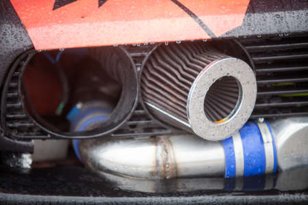 Color image of a tuned car air filter and exhaust pipe.の写真素材