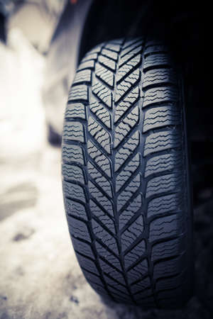 Close up shot of a car's winter tire.